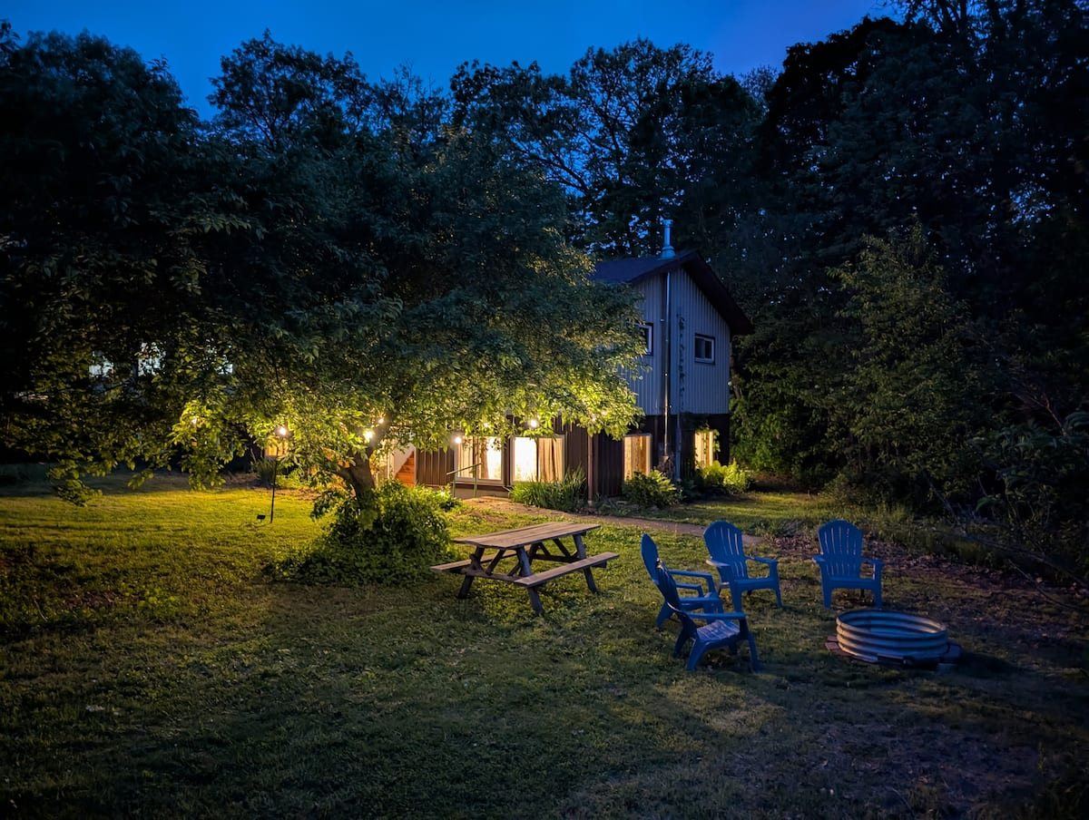 Farmstay house at Hungry World Farm at dusk