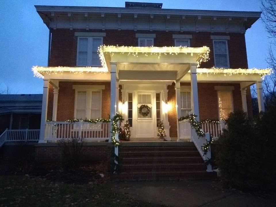 The Tiskilwa Inn porch glowing at dusk
